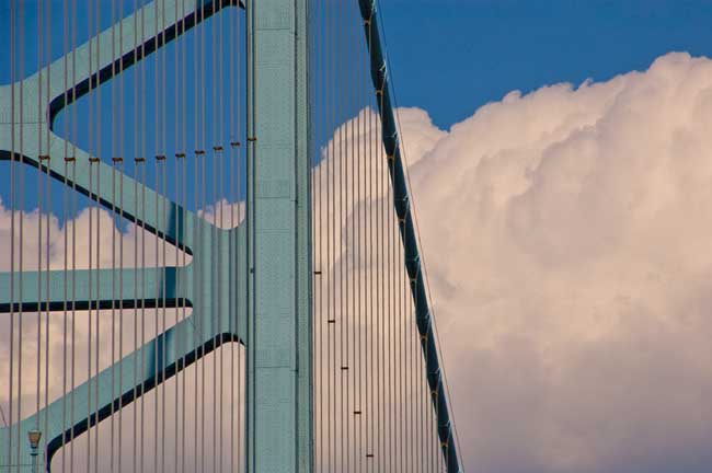 Suspension Bridge against Clouds