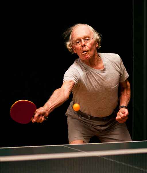 Senior citizen playing table tennis