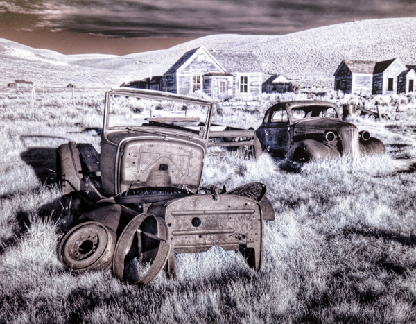 Wrecked Cars with Buildings in Background