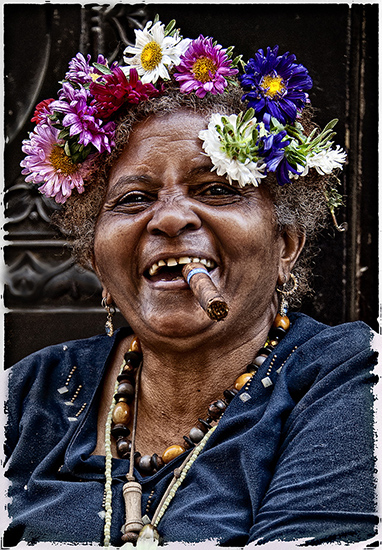 Cuban Woman with Flowers in Hair Smoking a Ciigar