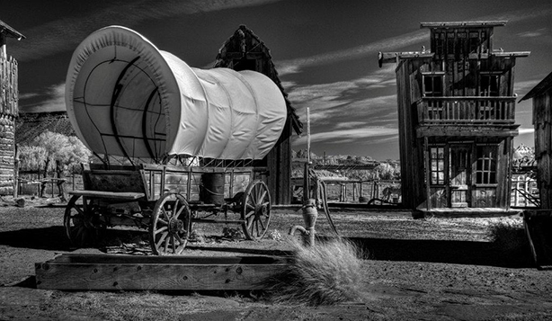 Covered Wagon and Old Western Buildings
