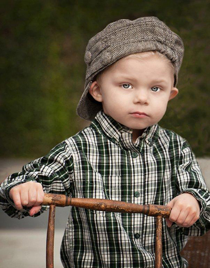 Little Boy in Old Fashioned Hat and Shirt