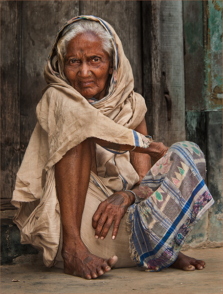 Elderly Lady Sitting in Doorway