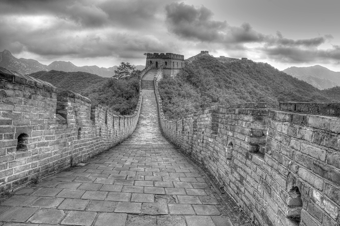 Looking down the walkway on the great wall with cloudy sky